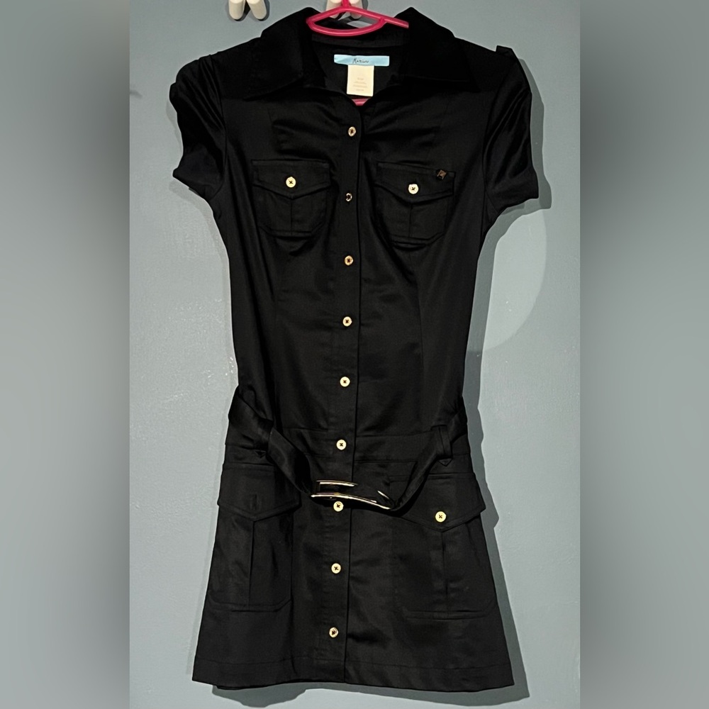 Fit to body, over the knee with small gold buttons on sleeves, the front & back.
